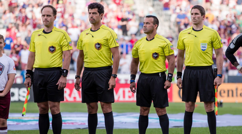 Brian Poeschel, Fotis Bazakos, Hilario Grajeda and Corey Parker stand before the match between the Colorado Rapids and the Seattle Sounders at Dick's Sporting Goods Park.