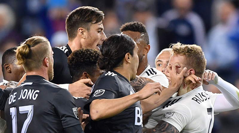Players from Sporting Kansas City and Vancouver Whitecaps come together.