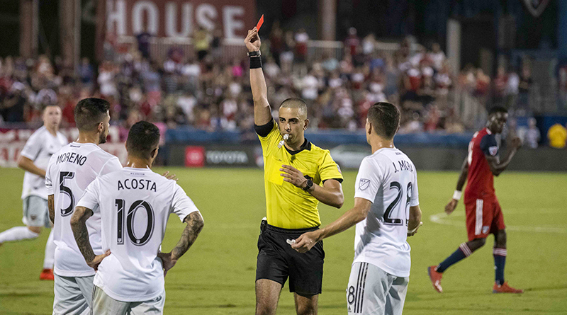 D.C. United midfielder Luciano Acosta (10) is issued a red card during the second half against FC Dallas at Toyota Stadium.