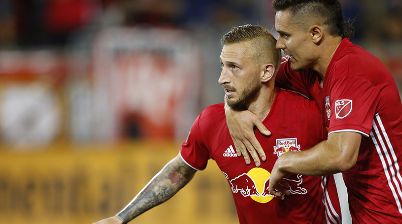 New York Red Bulls Daniel Royer (77) and Aaron Long (33) celebrate after scoring Royer converted a PK against Columbus Crew SC during the second half at Red Bull Arena.