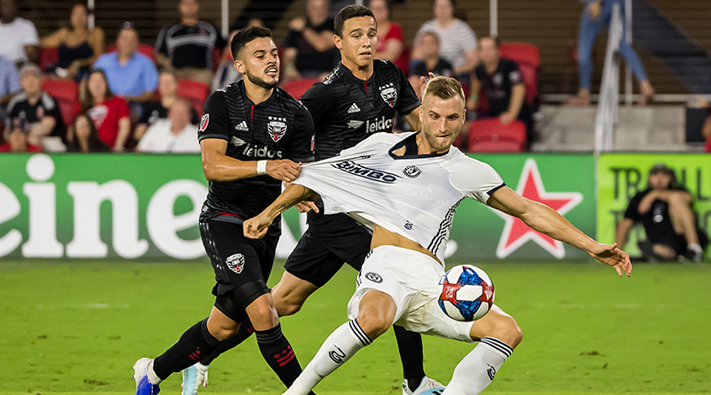 Philadelphia Union forward Kacper Przybylko (23) is pulled down by D.C. United midfielder Junior Moreno (5) during the first half at Audi Field.