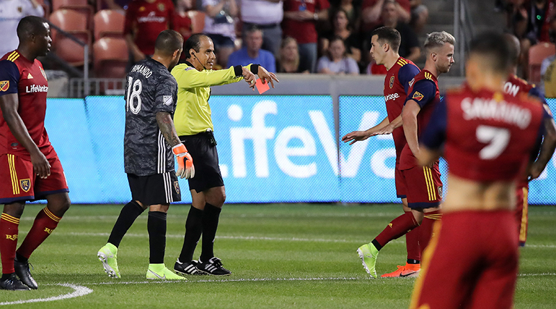 Referee Baldomero Toledo rescinds a red card given to Real Salt Lake defender Aaron Herrera (22) during the first half against the Los Angeles FC after reviewing the call during the first half at Rio Tinto Stadium.