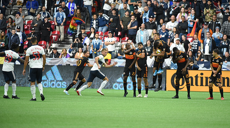 Houston Dynamo forward Mauro Manotas (9) blocks a free kick by Vancouver Whitecaps midfielder Yordy Reyna (29) during the second half at BC Place.