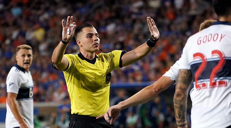 MLS referee Rosendo Mendoza signals in the game of the Vancouver Whitecaps against FC Cincinnati in the second half at Nippert Stadium.