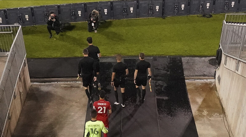 PRO officials lead Toronto FC out.