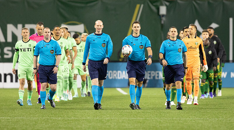 Referee Joseph Dickerson, assistant referees Mike Rottersman and Chris Elliott and fourth official Brad Jensen walk the team out before a game between Austin FC and Portland Timbers at Providence Park on March 12, 2022 in Portland, Oregon. James Self/isiphotos.com