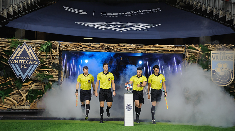 The referee crew enter the field before the start of the first half as the Vancouver Whitecaps host the Los Angeles FC at BC Place.