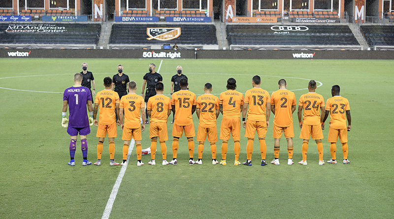 Houston Dynamo starting XI pose for a photo wearing jerseys with the names of pediatric cancer patients on them.